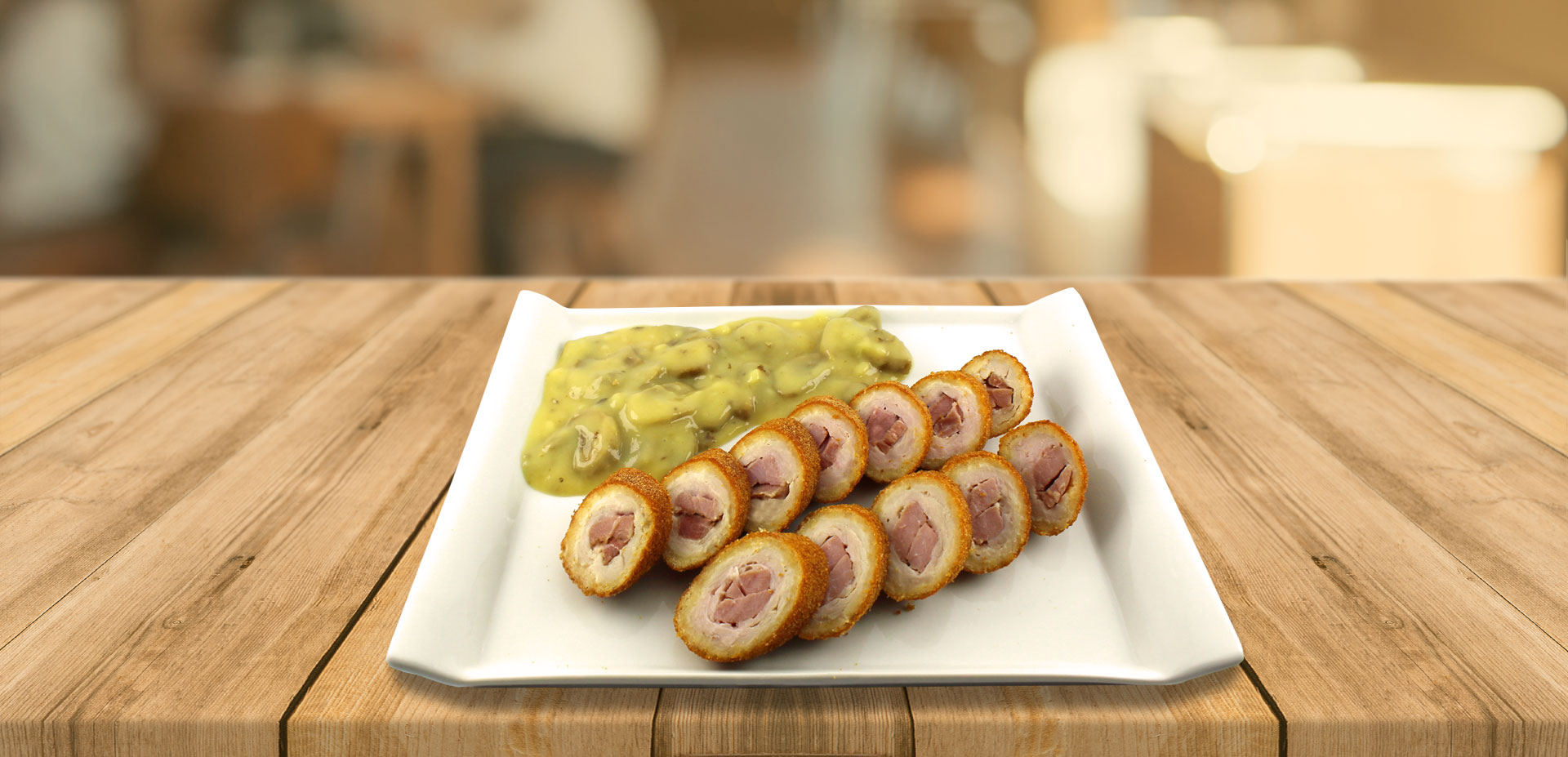 Flamenquín con salsa de champiñones